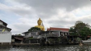 Canal and Big Buddha in wat Paknam