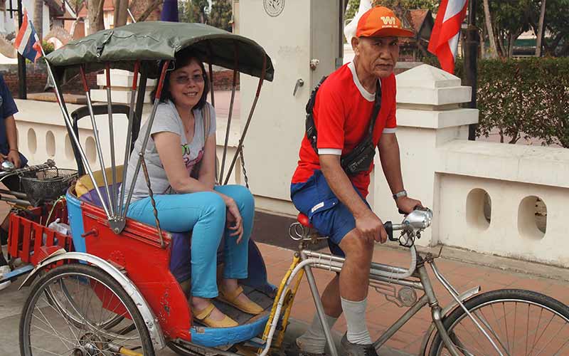 riding tricycle in Nan